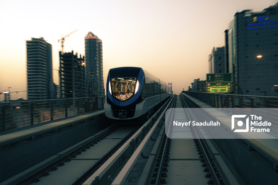 a train traveling through a city at dusk