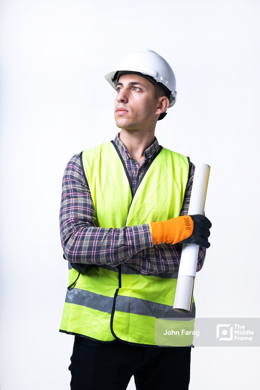 engineer standing with plans