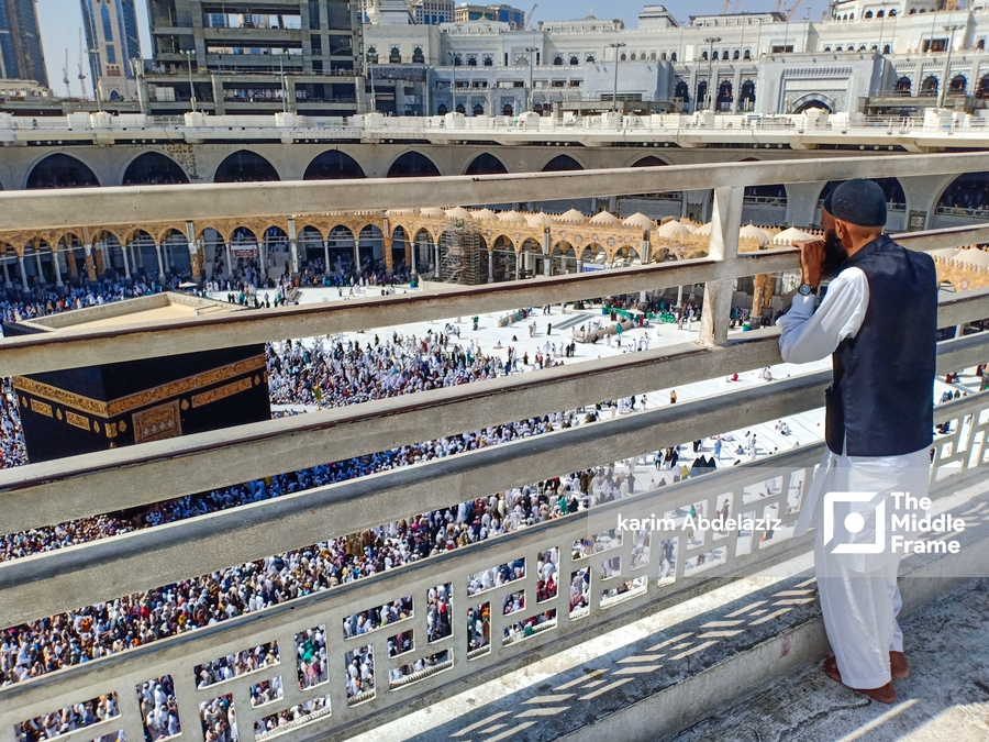 Religious Muslim watching the Hajj around Kaaba Mecca-Saudi Arabia.