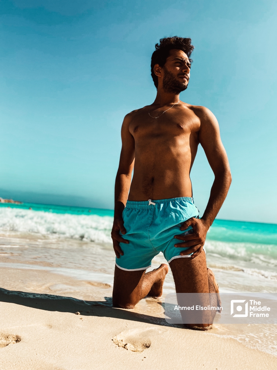 Young man sitting at the beach
