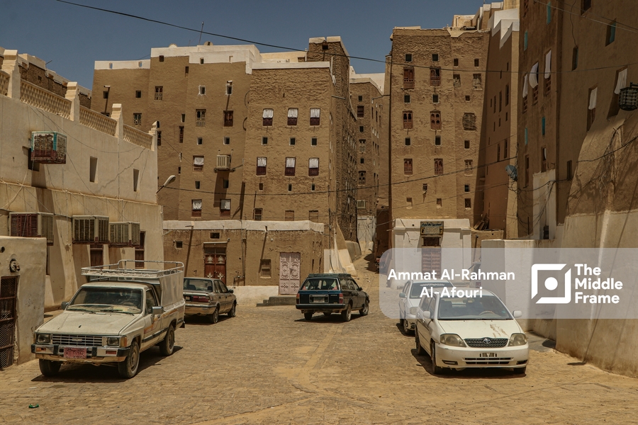 Cars parked in front of buildings