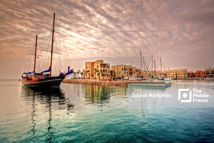 A boat in the water near a dock