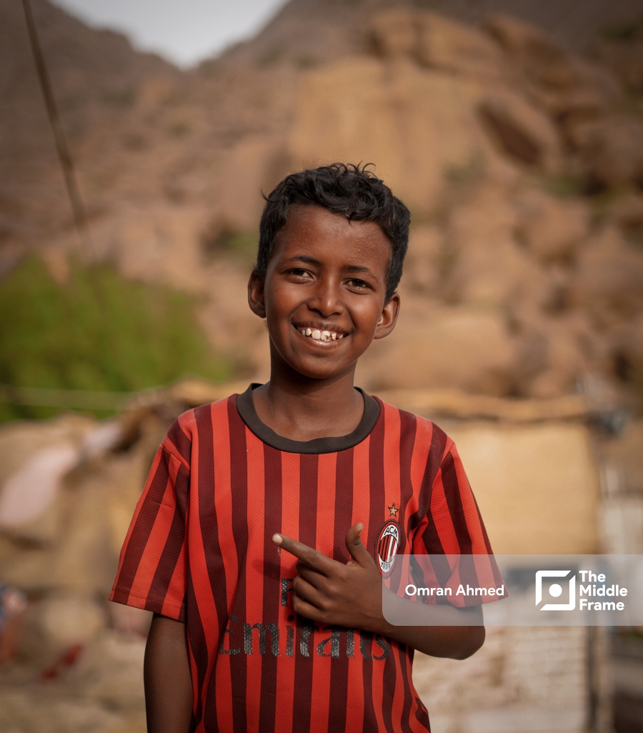 A portrait of a joyful Sudanese child.