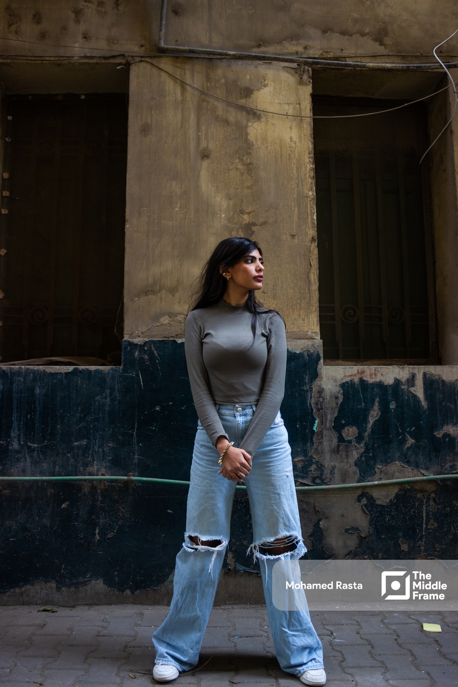 An Egyptian woman stands in the street