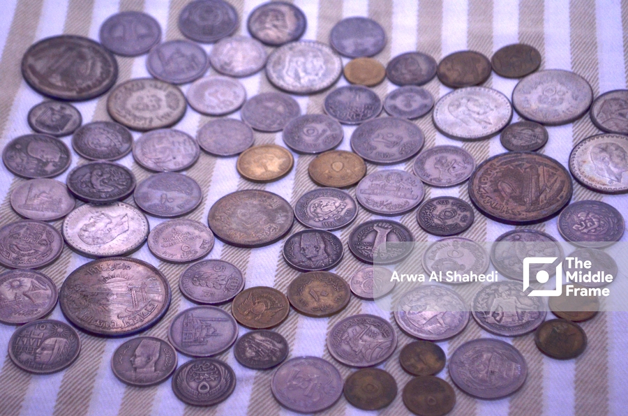 A pile of old Egyptian coins on a table