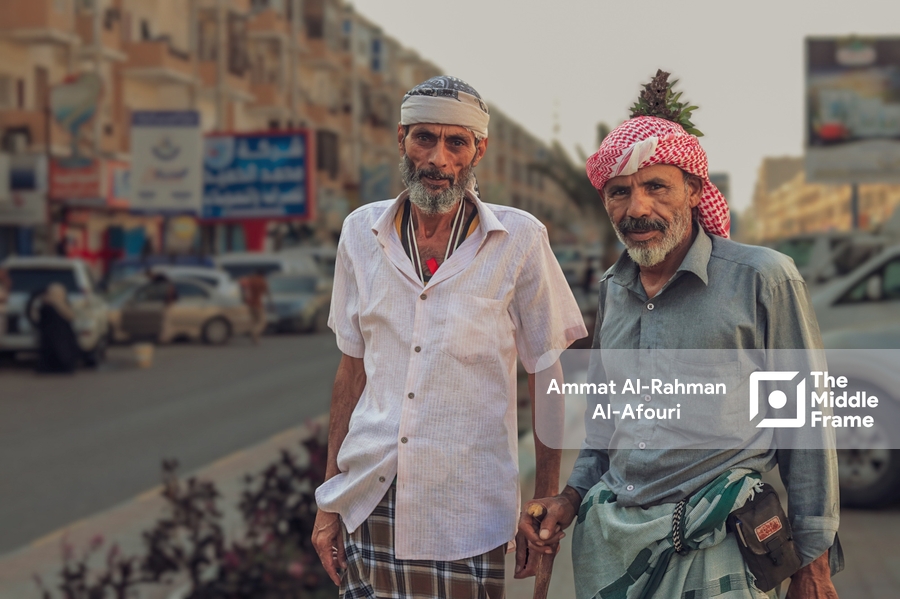 Elder men posing on the street