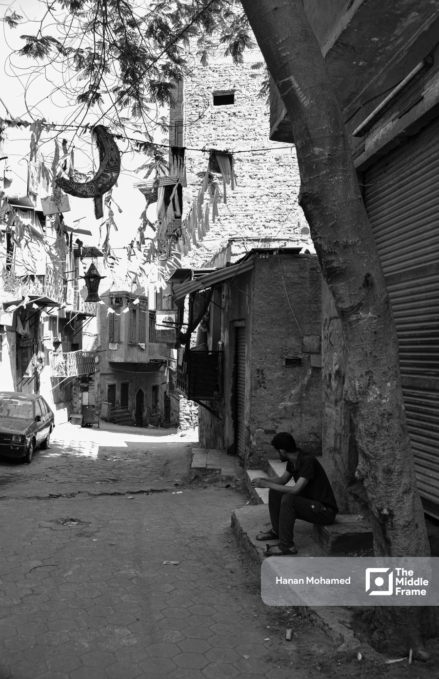 person sitting at street