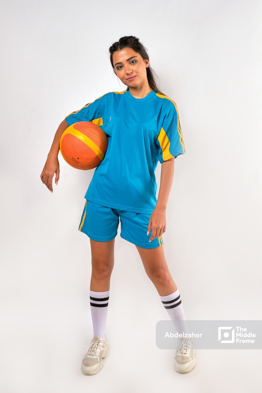 girl holding a basketball