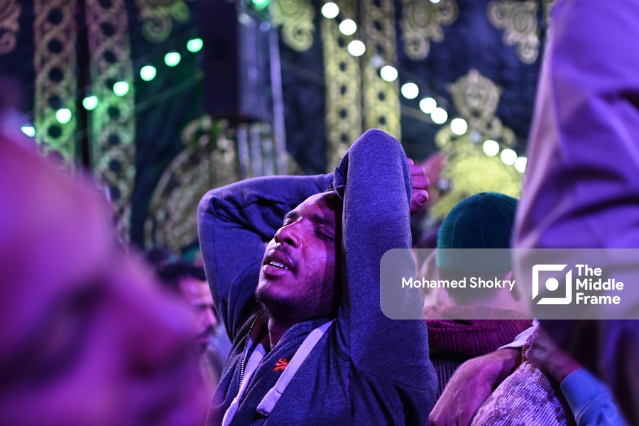 Man reacting to the beauty of Sufi songs in the birth of "Al-Sayyda Zeinab" Egypt.