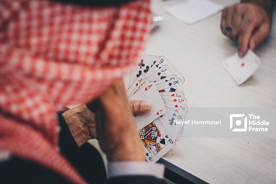 Arab man playing cards