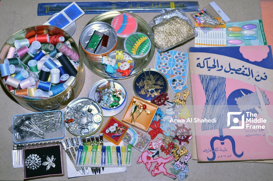 A table with various items and a metal container