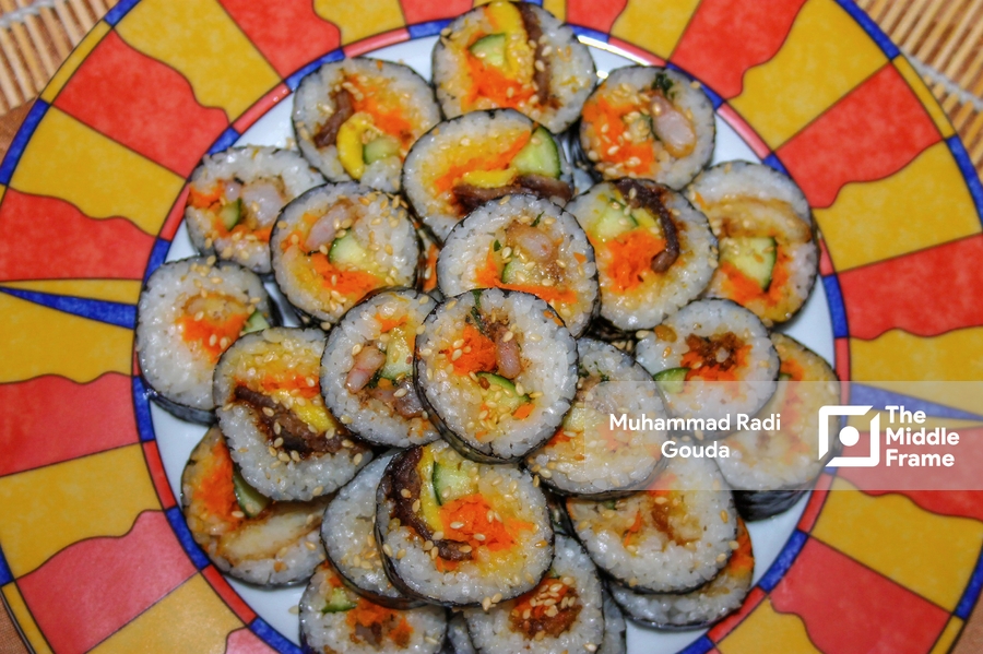 A plate full of sushi rolls