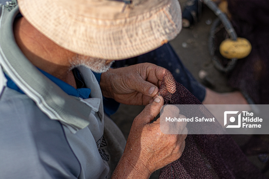 Fishermen fixing the fishing net in Kafr Elsheikh-Egypt.