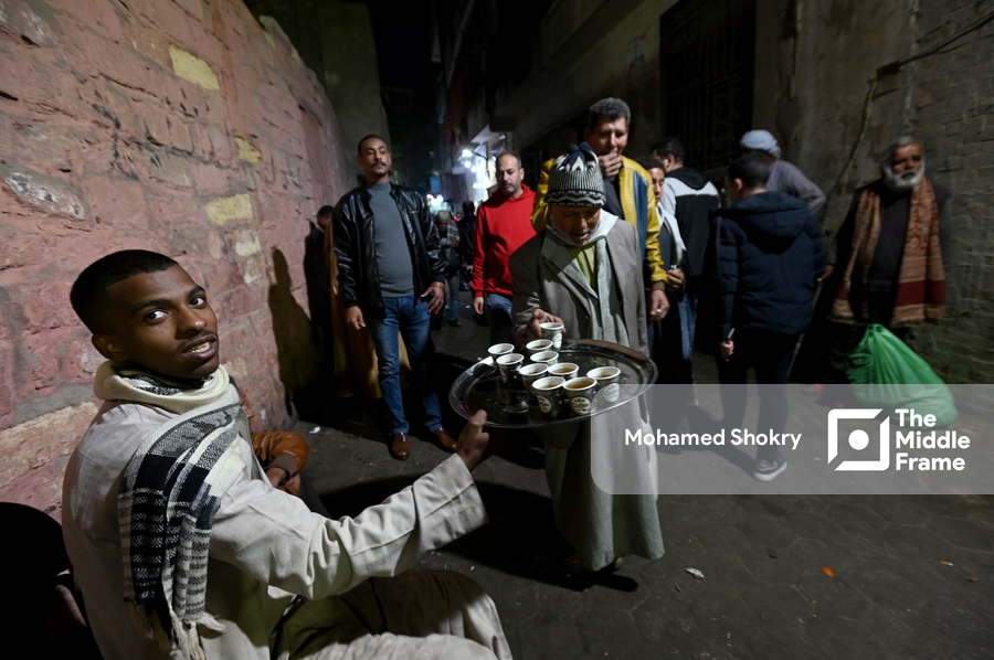 Old man serving tea in the Birth of Al-Sayyda Zeinab.
