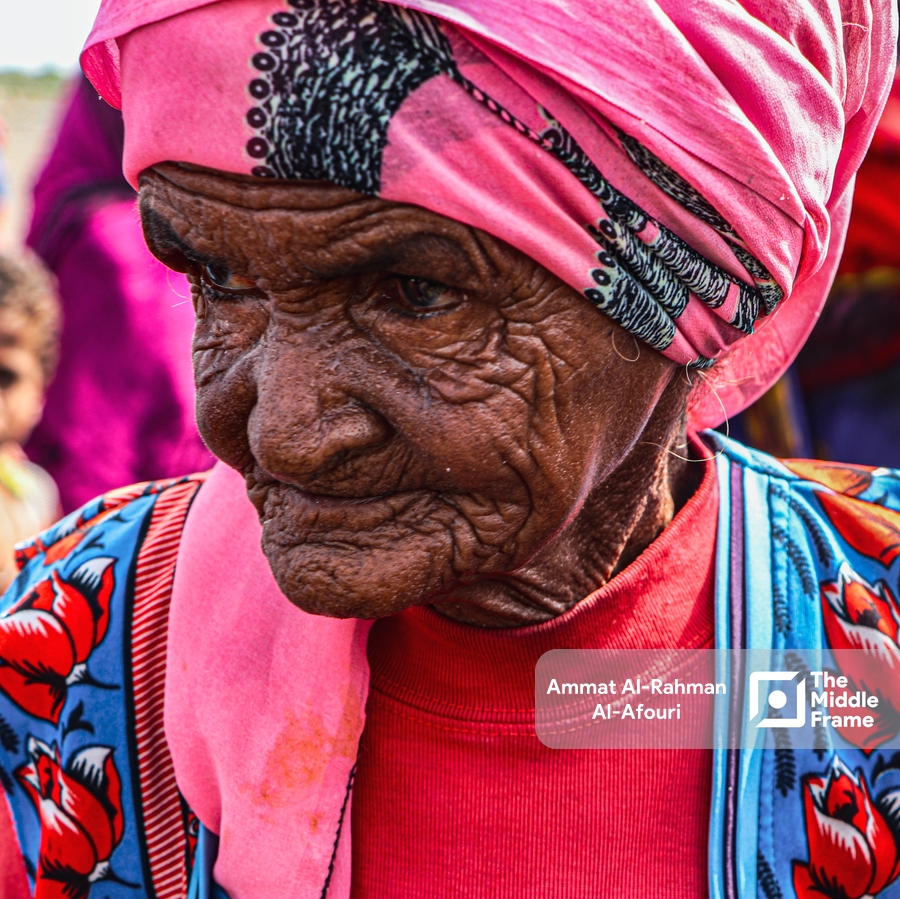 An old woman posing under sunlight in Yemen
