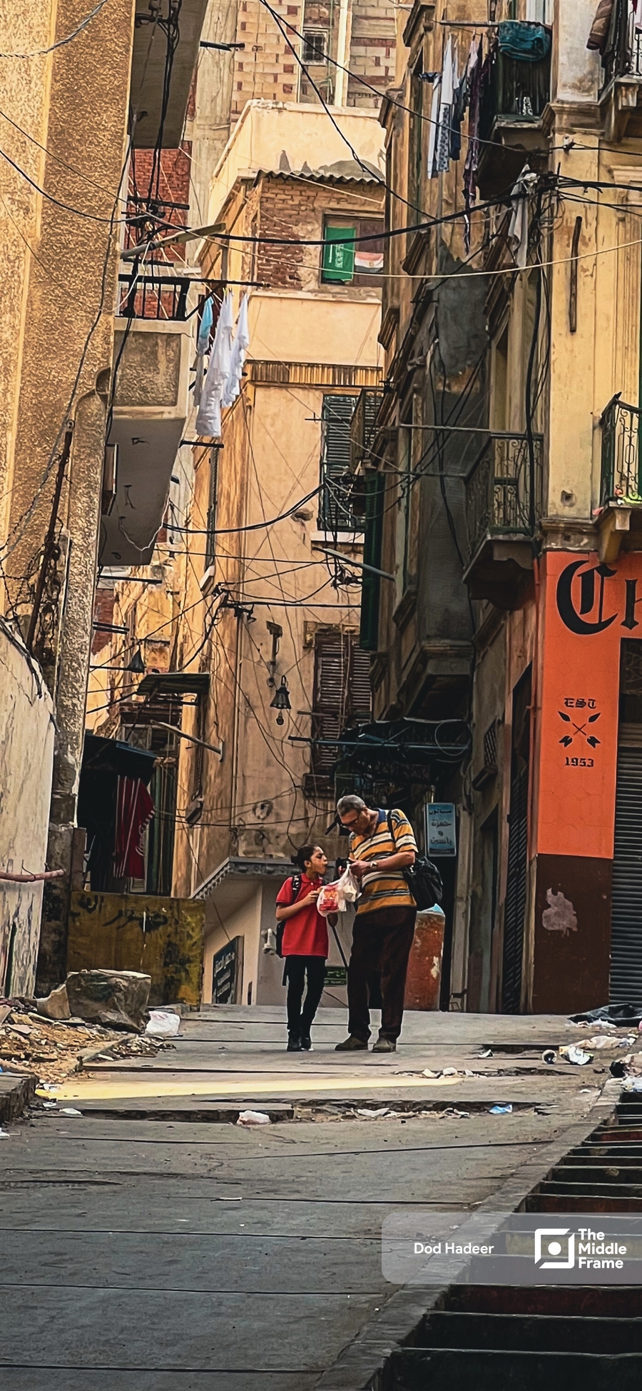 a man walks through the streets of the old city