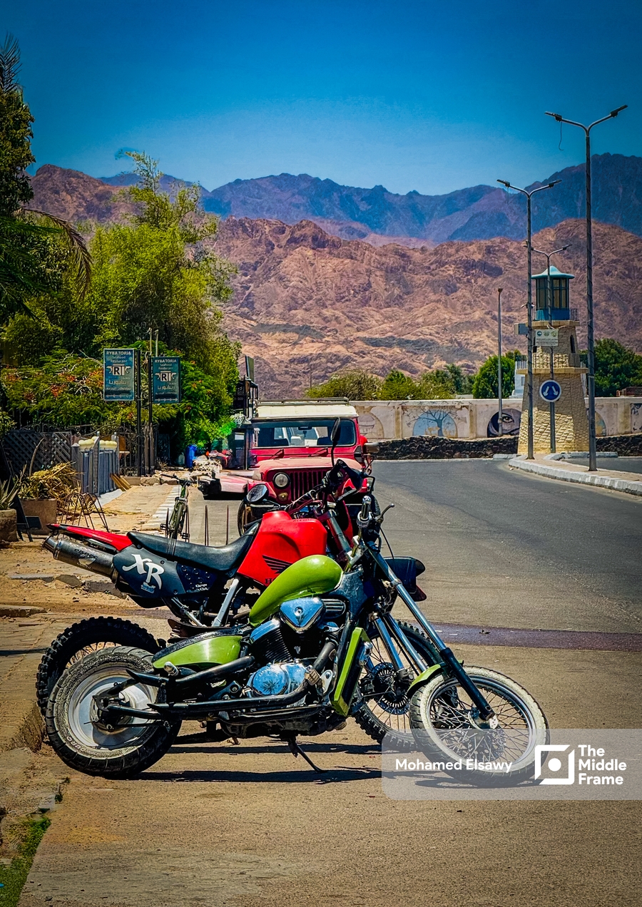 a motorcycle parked on the side of a road