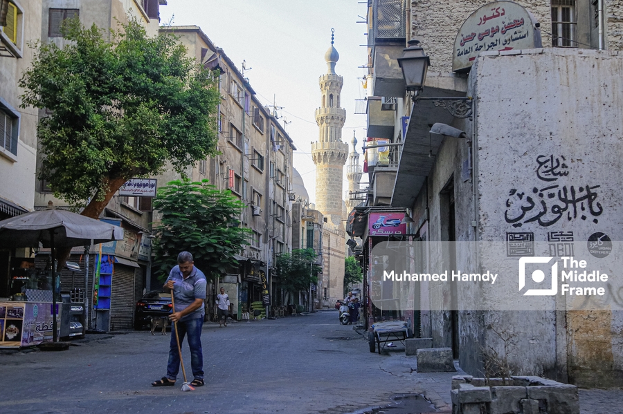 A man sweeping the street in Cairo, Egypt