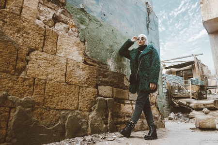 An Egyptian woman posing in the street