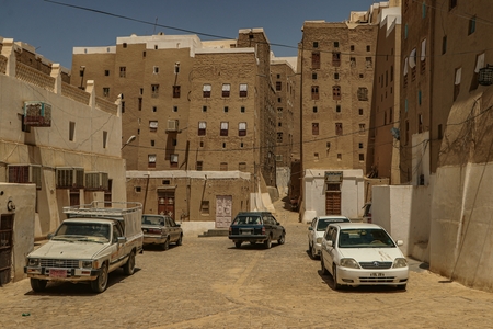 Cars parked in front of buildings