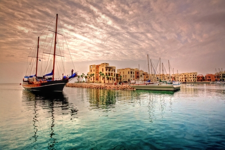 A boat in the water near a dock
