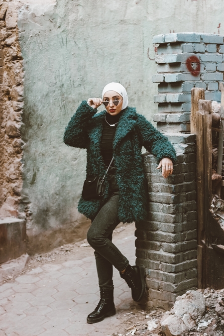 An Egyptian woman posing in the street