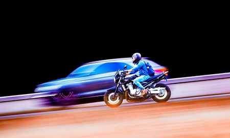 A person riding a motorcycle on a track