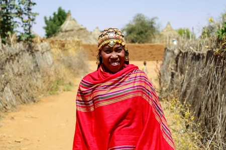 Portrait of a Sudanese woman in traditional attire.