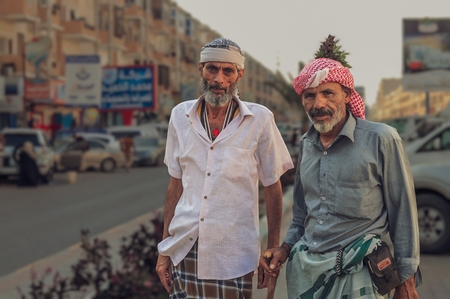 Elder men posing on the street