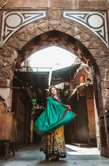 An Egyptian woman poses in the street