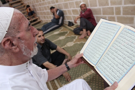 Reading the Quran.