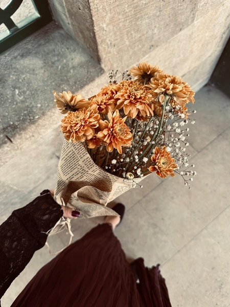 A girl holding a bouquet of flowers