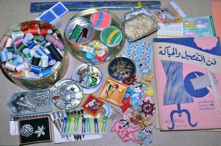 A table with various items and a metal container