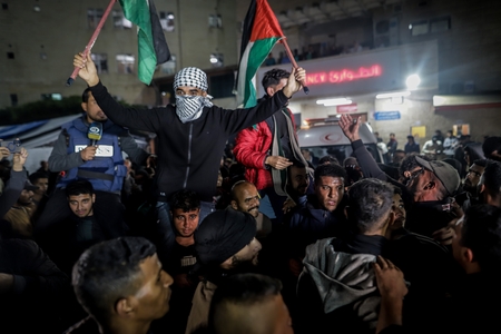 Palestinians celebrating the announcement of a ceasefire.