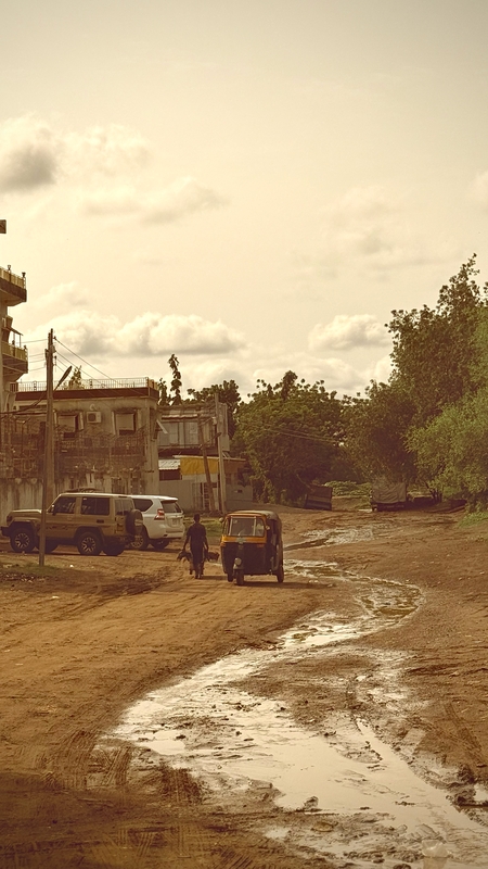 a building with a lot of dirt on the ground