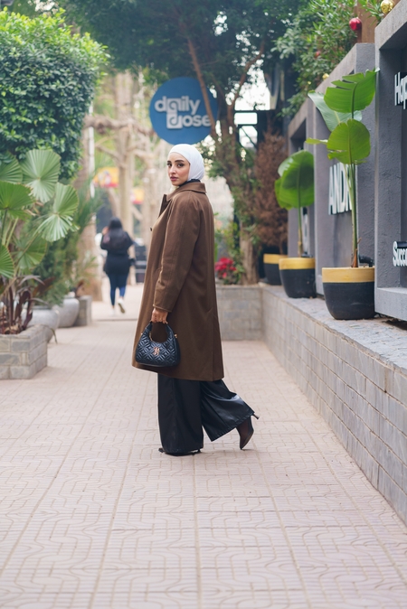 A hijabi Egyptian woman posing in the street