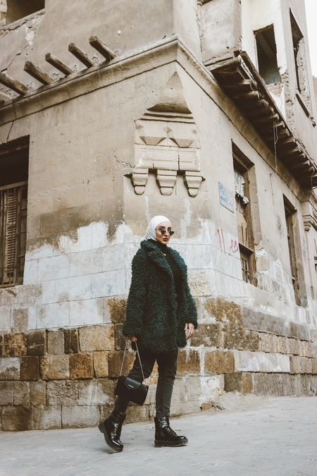 An Egyptian woman posing in the street