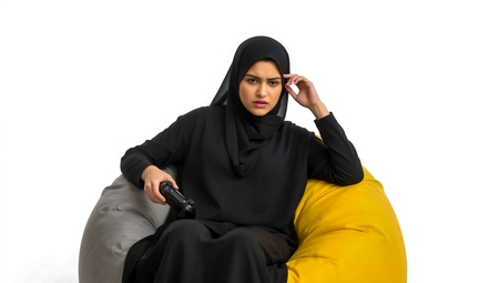 A woman sitting on a bean bag chair