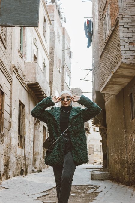 An Egyptian woman posing in the street