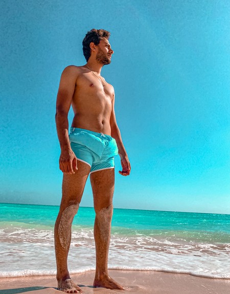 Young man standing at the beach